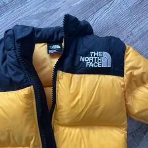 The North Face yellow winter coat. Size 6-12 months